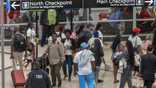 Crowds at Hartsfield-Jackson International Airport on Friday, Aug. 30, 2024. John Spink/AJC)