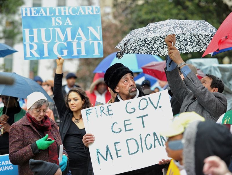 About 200 people attended the Moral Monday rally at the state Capitol, calling on Gov. Nathan Deal to expand Georgia’s Medicaid program, on Jan. 13. BRANT SANDERLIN / BSANDERLIN@AJC.COM