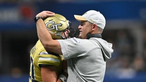 Georgia Tech coach Brent Key congratulates tight end Brett Seither (80) after he scored a touchdown during the first half of the inaugural Aflac Kickoff game at Mercedes-Benz Stadium, Friday, September 1, 2023, in Atlanta. (Hyosub Shin / Hyosub.Shin@ajc.com)