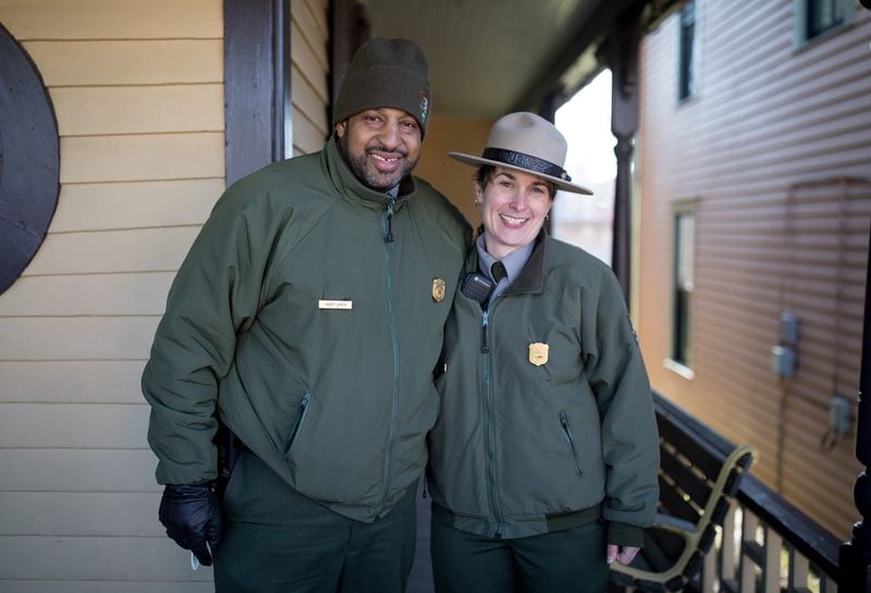 National Park Service rangers Marty Smith (left) and Rebecca Karcher pose together at the birthplace of the Rev. Martin Luther King Jr. in Atlanta. In their job, they help visitors understand the history that happened at sites key to King’s life. BRANDEN CAMP / SPECIAL TO THE AJC