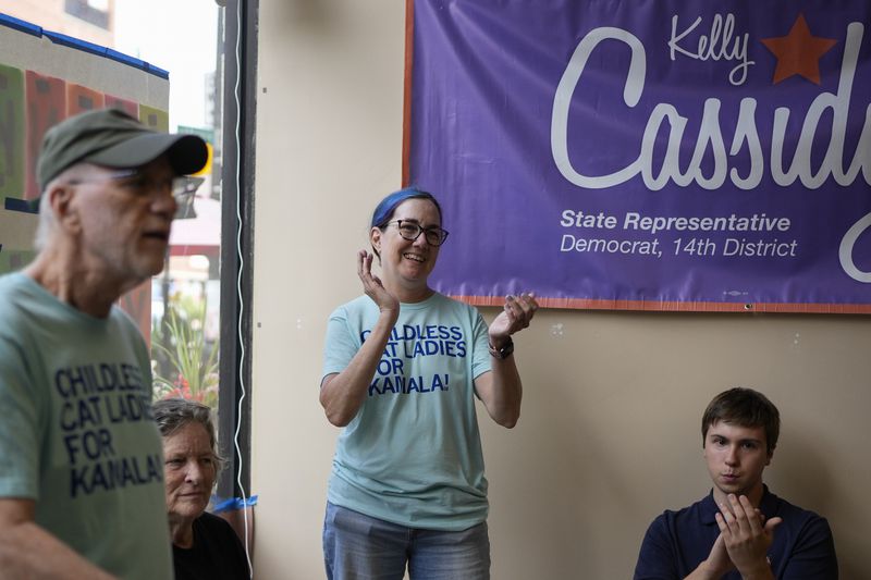 Illinois Rep. Kelly Cassidy meets with volunteers as Democrats plan canvassing efforts in Wisconsin and Michigan as part of "Operation Swing State," Sunday, July 28, 2024, in Chicago. (AP Photo/Erin Hooley)