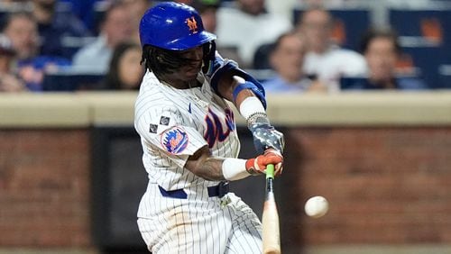 New York Mets' Luisangel Acuna hits a home run during the eighth inning of a baseball game against the Washington Nationals, Tuesday, Sept. 17, 2024, in New York. (AP Photo/Frank Franklin II)