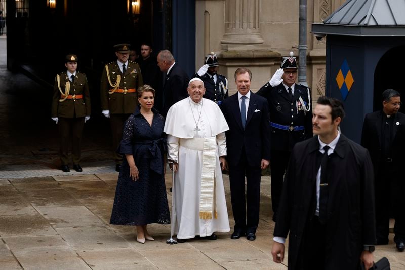 Pope Francis is welcomed by Grand Duchess Maria Teresa, left, and Luxembourg's Grand Duke Henri, right, at the Grand Ducal Palace in Luxembourg, Thursday, Sept. 26, 2024. (AP Photo/Omar Havana)