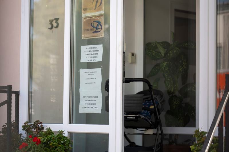 This shows a sing featuring the names of several companies on the door of a house where a Hungarian company that allegedly manufactured pagers that exploded in Lebanon and Syria is headquartered in Budapest Wednesday, Sept. 18, 2024. (AP Photo/Denes Erdos)