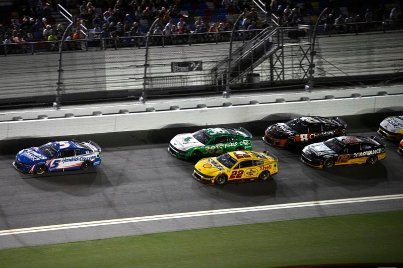 Kyle Larson (5) leads Todd Gilliland (38), Joey Logano (22), Kyle Busch (8) and Ryan Blaney (12) through the front stretch during a NASCAR Cup Series auto race at Daytona International Speedway, Saturday, Aug. 24, 2024, in Daytona Beach, Fla. (AP Photo/Phelan M. Ebenhack)