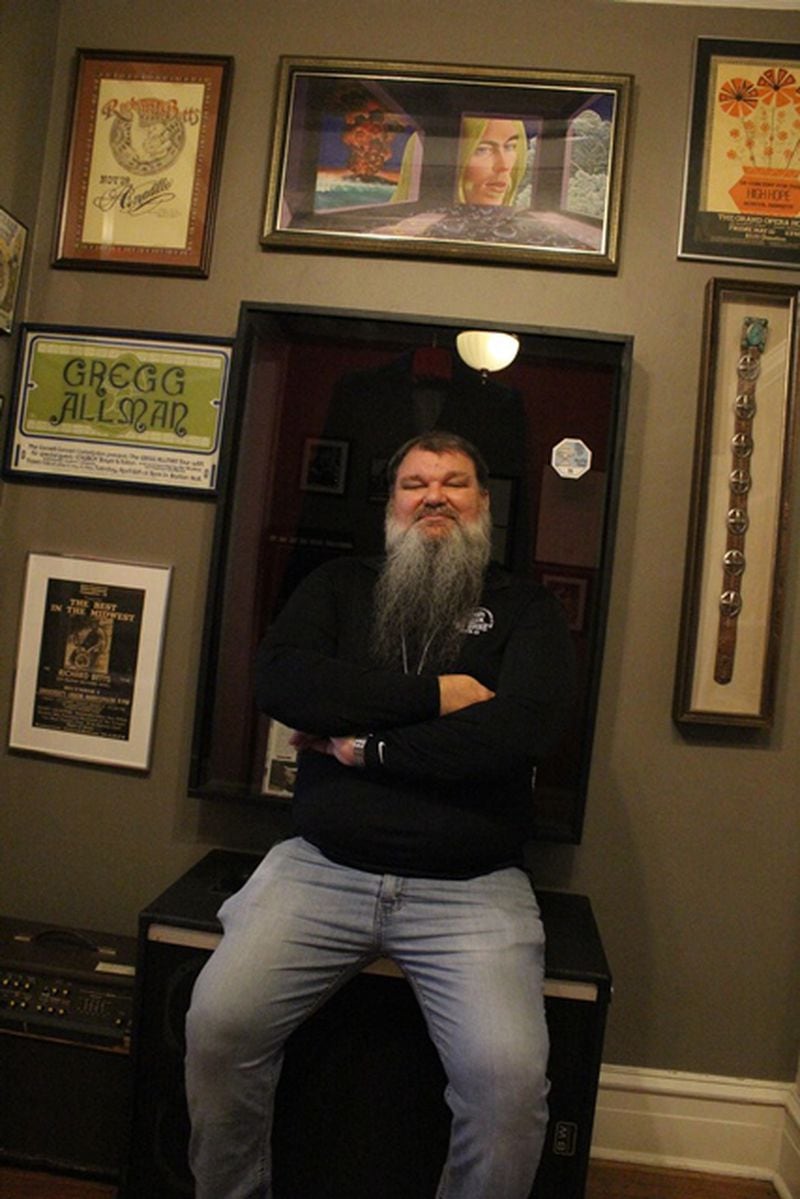 Richard Brent, the director of The Big House Museum in Macon, poses with some of the memorabilia in the Macon shrine. Photo: Melissa Ruggieri/Atlanta Journal-Constitution