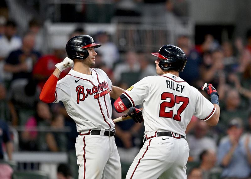 Braves third baseman Austin Riley (right) celebrates with first baseman Matt Olson after hitting a solo home run during the seventh inning at Truist Park, Wednesday, July 19, 2023, in Atlanta.  (Hyosub Shin / Hyosub.Shin@ajc.com)