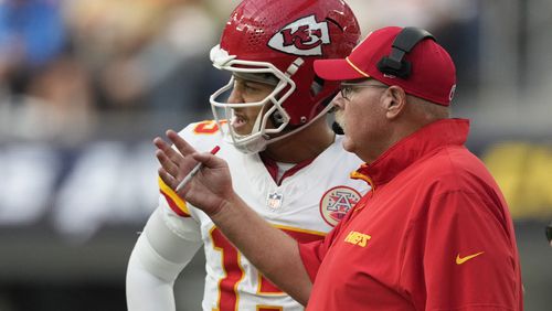 Kansas City Chiefs quarterback Patrick Mahomes, left, talks with head coach Andy Reid during the second half of an NFL football game against the Los Angeles Chargers Sunday, Sept. 29, 2024, in Inglewood, Calif. (AP Photo/Ashley Landis)