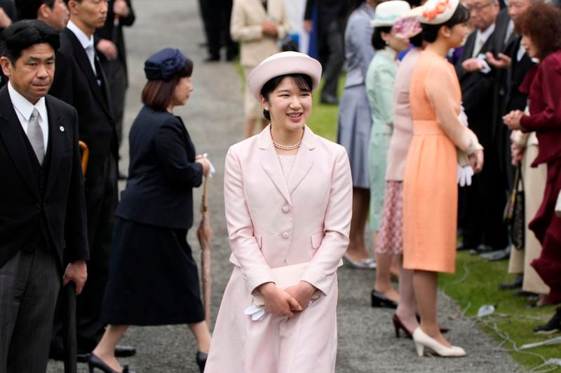 FILE- Japan's Princess Aiko greets guests during the spring garden party at the Akasaka Palace imperial garden Tuesday, April 23, 2024, in Tokyo. (AP Photo/Eugene Hoshiko, File)