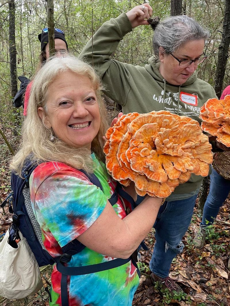 Anne-Marie Bilella beams with pride after foraging a chicken of the woods mushroom. 
(Courtesy of Anne-Marie Bilella)