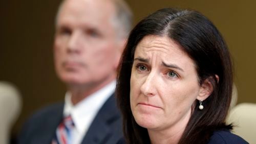 Katie McLaughlin, former wife of former Subway pitchman Jared Fogle, makes a statement on legal action filed on her behalf as attorney Mike Antrim looks on during a press conference in Noblesville, Ind., Monday, Oct. 24, 2016. (AP Photo/Michael Conroy)