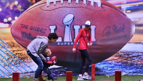 January 30, 2019 Atlanta - Visitors participates in a football drill during Super Bowl Experience inside Georgia World Congress Center on Wednesday, January 30, 2019. HYOSUB SHIN / HSHIN@AJC.COM