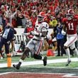 Georgia defensive back Kelee Ringo intercepts Alabama and returns it for a touchdown for a 33-18 lead and victory over Alabama in the College Football Playoff championship game on Monday, Jan. 10, 2022, in Indianapolis. (AJC 2022)