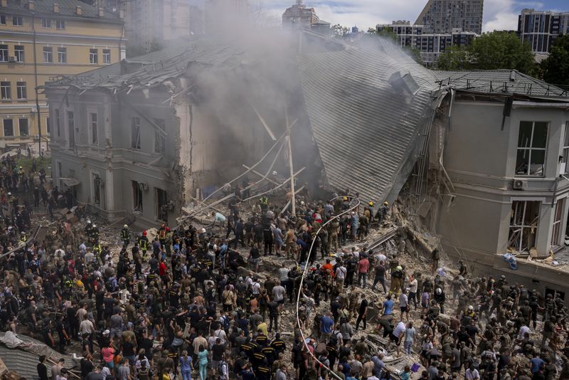 FILE - Emergency workers respond at the Okhmatdyt children's hospital hit by Russian missiles, in Kyiv, Ukraine, Monday, July 8, 2024. (AP Photo/Alex Babenko, File)