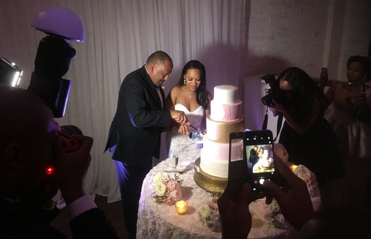 Frank Ski and Dr. Patrice Basanta-Henry cut their wedding cake at The Estate in November 2017. Photo by Jennifer Brett