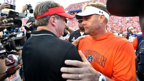 Georgia head coach Kirby Smart and Auburn head coach Hugh Freeze shake hands afterGeorgia beat Auburn in an NCAA football game at Jordan-Hare Stadium, Saturday, September 30, 2023, in Auburn, Alabama. Georgia won 27-20 over Auburn. (Hyosub Shin / Hyosub.Shin@ajc.com)