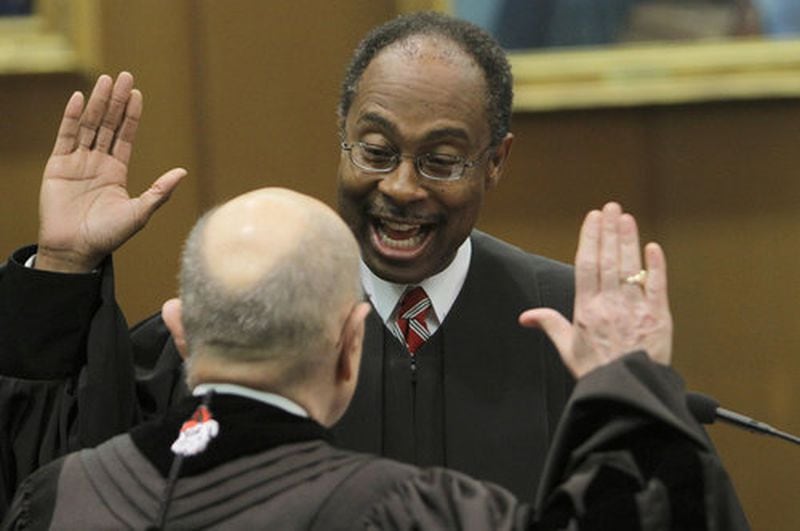Judge Steve Jones, United States District Court, swears in George Carley (foreground) as chief justice of the Supreme Court of Georgia on May 29, 2012. (AJC 2012 file photo)