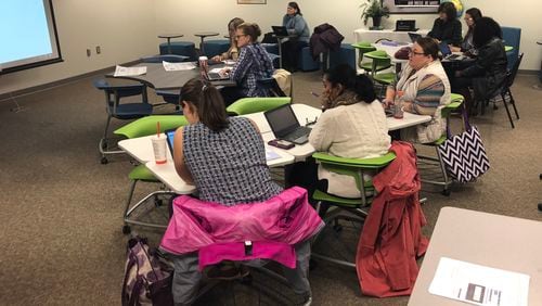 The furniture from Michelle Clarke’s Madras Middle School classroom was moved into the Coweta County Schools headquarters in Newnan, where teachers use it during training sessions. MARLON A. WALKER/ MARLON.WALKER@AJC.COM