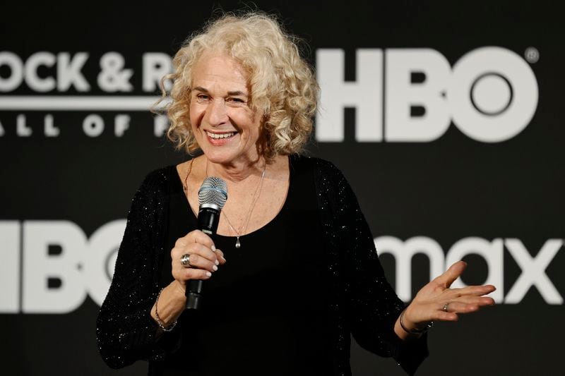 FILE - Carole King answers questions during the Rock and Roll Hall of Fame Induction ceremony, Oct. 30, 2021, in Cleveland. Celebrities including King are increasingly lending their star power to President Joe Biden, hoping to energize fans to vote for him in November 2024 or entice donors to open their checkbooks for his reelection campaign. (AP Photo/Ron Schwane, File)