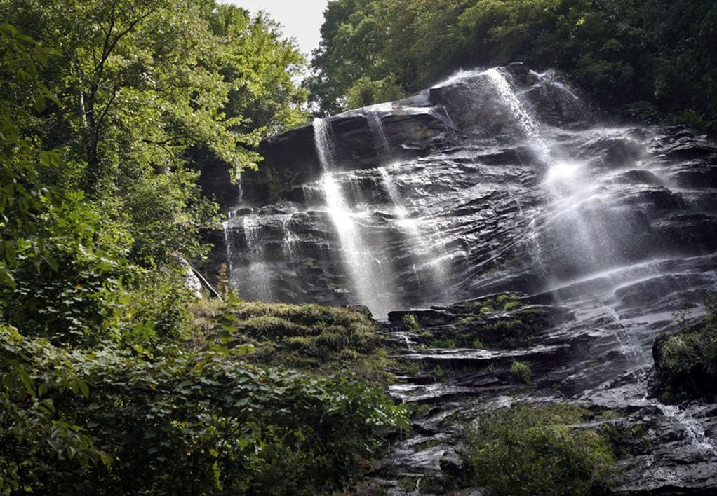 Small waterfall with water splashing and tumbling over the rocks