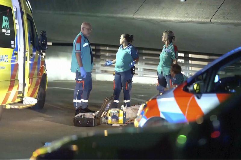 In this image made from video provided by Media TV, personnel respond to a stabbing incident late Thursday, Sept. 19, 2024, in the port city of Rotterdam, Netherlands. (Media TV via AP)