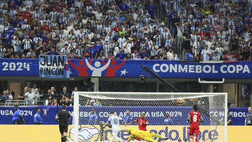 Argentina fans watch intensely as Argentina forward Lionel Messi (10) makes a move against Canada goalkeeper Maxime Crépeau (16) during the second half in the 2024 Copa America at Mercedes-Benz Stadium, Thursday, June 20, 2024, in Atlanta. Argentina won 2-0. (Jason Getz / AJC)
