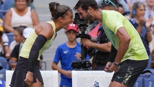 Sara Errani, of Italy, and Andrea Vavassori, of Italy, react after defeating Taylor Townsend, of the United States, and Donald Young, of the United States, in the mixed doubles final of the U.S. Open tennis championships, Thursday, Sept. 5, 2024, in New York. (AP Photo/Julia Nikhinson)