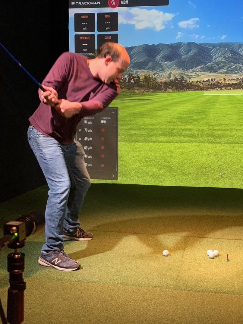 At Five Iron Golf in Midtown, guests can virtually play a round on more than 200 famed courses and plug into technology to improve their games similar to what pros use.
(Mary Welch for The Atlanta Journal-Constitution)