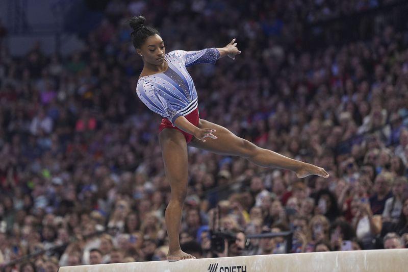 Simone Biles bobbles on the balance beam at the United States Gymnastics Olympic Trials on Friday, June 28, 2024 in Minneapolis. (AP Photo/Abbie Parr)