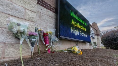 Students and well wishers left flowers at the school’s sign at Apalachee High School in Winder on Thursday, Sept. 5, 2024. A 14-year-old is accused of shooting and killing two fellow students and two teachers and injuring nine others at Apalachee High School on Wednesday. (John Spink/AJC)