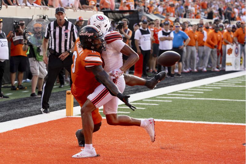 Utah safety Rabbit Evans (13) is called for defensive pass interference on Oklahoma State running back Ollie Gordon II (0) during a two-point conversion attempt in the second half of an NCAA college football game Saturday, Sept. 21, 2024, in Stillwater, Okla. (AP Photo/Mitch Alcala)