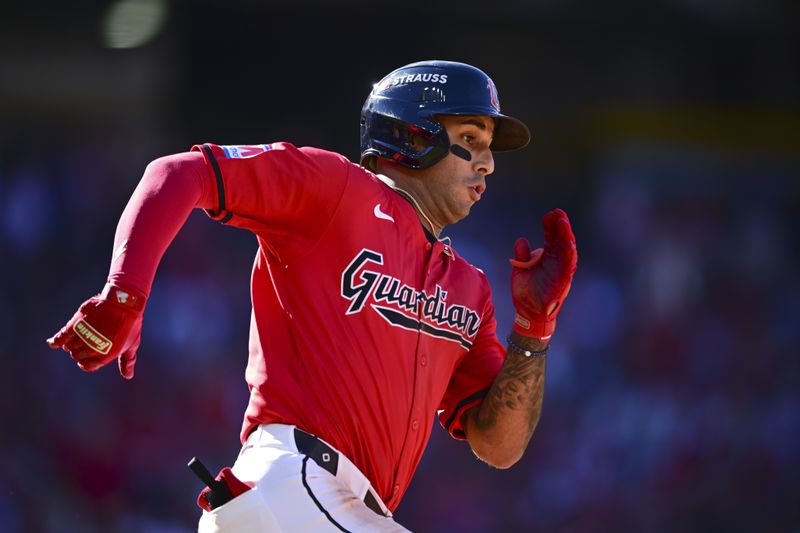 Cleveland Guardians' Brayan Rocchio runs to second base with a double in the eighth inning during Game 1 of baseball's AL Division Series against the Detroit Tigers, Saturday, Oct. 5, 2024, in Cleveland. (AP Photo/David Dermer)