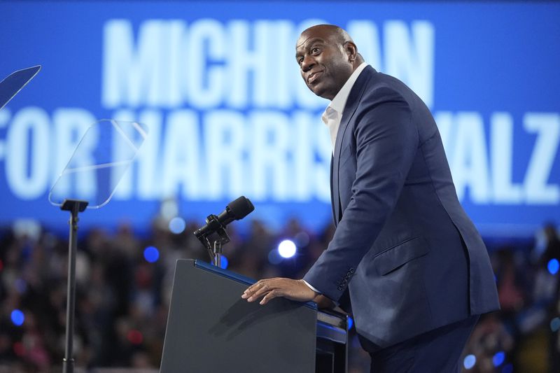 Magic Johnson speaks at a campaign rally for Democratic presidential nominee Vice President Kamala Harris at the Dort Financial Center in Flint, Mich., Friday, Oct. 4, 2024. (AP Photo/Mark Schiefelbein)