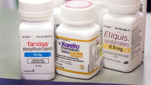 Farxiga, Xarelto, and Eliquis at the New City Halsted Pharmacy on Aug. 29 in Chicago. These are three of 10 prescription drugs that will be subject to Medicare price negotiations under the Inflation Reduction Act. (Photo Illustration by Scott Olson/Getty Images/TNS)