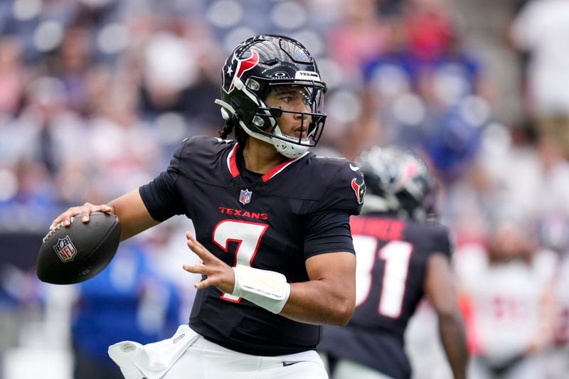 Houston Texans quarterback C.J. Stroud drops back to pass in the first half of a preseason NFL football game against the New York Giants, Saturday, Aug. 17, 2024, in Houston. (AP Photo/Eric Christian Smith)