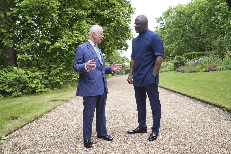King Charles III and Idris Elba, attend an event for The King's Trust to discuss youth opportunity, at St James's Palace in central London, Friday July 12, 2024. The King and Mr Elba, an alumnus of The King's Trust (formerly known as The Prince's Trust), are meeting about the charity's ongoing work to support young people, and creating positive opportunities and initiatives which might help address youth violence in the UK, as well as the collaboration in Sierra Leone between the Prince's Trust International and the Elba Hope Foundation. (Yui Mok/pool photo via AP)