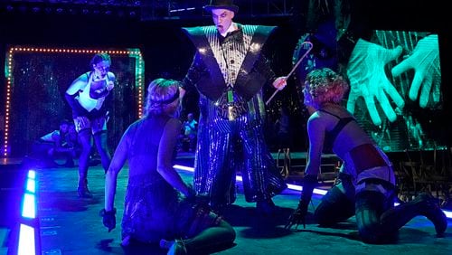 Atlanta Opera’s staging of the classic musical “Cabaret,” co-starring Curt Olds (center) as the Emcee, continues through June 19 in a warehouse setting at the Pullman Yards complex.
Courtesy of Ken Howard