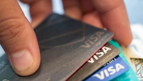 FILE - Visa credit cards in New Orleans, Aug. 11, 2019. Consumers are increasingly struggling to pay their credit card bills, raising concerns about severe delinquencies spiraling and sapping consumer spending. (AP Photo/Jenny Kane, File)