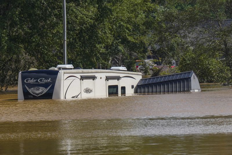 The Riverside RV park was flooded from the overflowing Catawba River after torrential rain from Hurricane Helene, Saturday, Sept. 28, 2024, in Morganton, N.C. (AP Photo/Kathy Kmonicek)