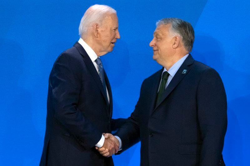 President Joe Biden, left, greets Viktor Orban, Prime Minister of Hungary, as he arrives for a welcome ceremony at the NATO summit in Washington, Wednesday, July 10, 2024. (AP Photo/Mark Schiefelbein)