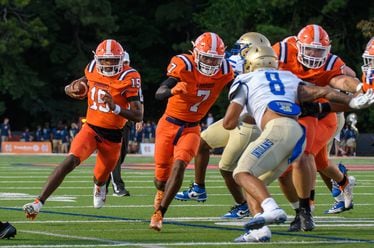 Nick Grimstead, quarterback for North Cobb, finds a hole during the football game against McEachern in Kennesaw, GA on August 23, 2024 (Jamie Spaar for the Atlanta Journal Constitution)