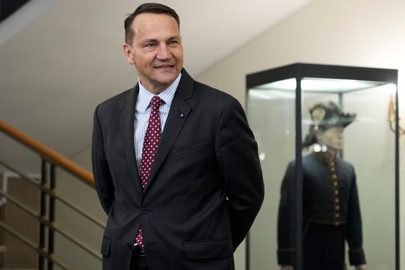 Polish Foreign Minister Radosław Sikorski waits for the arrival of U.S. Secretary of State, Antony Blinken for a talks in Warsaw, Poland, Thursday, Sept. 12, 2024. (AP Photo/Czarek Sokolowski)