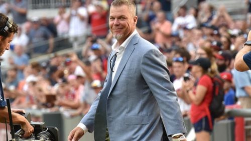 Chipper Jones walks onto the field for a pregame ceremony before the Braves' home game against the Milwaukee Brewers in 2018. HYOSUB SHIN / HSHIN@AJC.COM