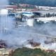 This aerial view, taken on the side of I-20, shows smoke traveling west from the Biolab facility in Conyers on Thursday.
(Miguel Martinez / AJC)