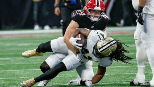 Atlanta Falcons linebacker Troy Andersen (44) stops New Orleans Saints running back Alvin Kamara (41) during the first half of an NFL football game against the New Orleans Saints on Sunday, Sept. 29, at Mercedes-Benz Stadium in Atlanta.

(Miguel Martinez/ AJC)