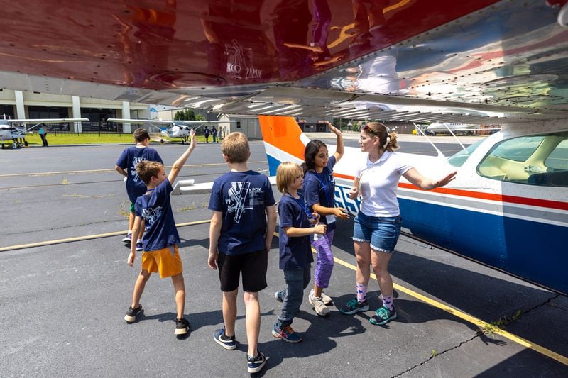 Children learn about pre-flight safety during ASPIRE Aviation Summer Camp at Dekalb-Peachtree Airport in Chamblee on Thursday, June 29, 2023. (Arvin Temkar / arvin.temkar@ajc.com)