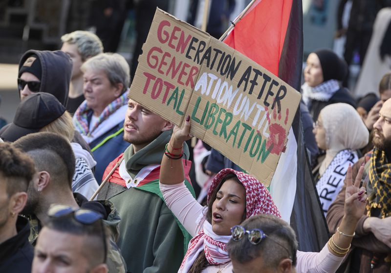 People demonstrate in support of Palestinians in Hamburg, Germany, Saturday, Oct. 5, 2024. (Georg Wendt/dpa via AP)