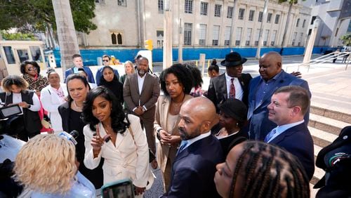 FILE - Co-founders and CEOs of The Fearless Fund Arian Simone, center left, and Ayana Parsons, center right, speak to journalists outside the James Lawrence King Federal Building in Miami, as they leave with their legal team following a hearing on Wednesday, Jan. 31, 2024. (AP Photo/Rebecca Blackwell, File)