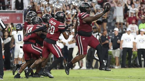 South Carolina defensive tackle DeAndre Jules (99) recovers a fumble and celebrates during the second half of an NCAA college football game against Old Dominion, Saturday, Aug. 31, 2024, in Columbia, S.C. (AP Photo/Artie Walker Jr.)