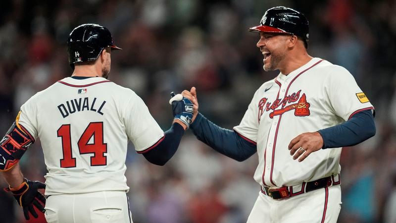 Atlanta Braves outfielder Adam Duvall (14) celebrates after hitting a solo homer against the Philadelphia Phillies in the sixth inning of a baseball game, Thursday, Aug. 22, 2024, in Atlanta. (AP Photo/Mike Stewart)